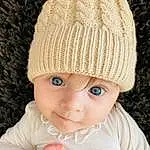 Clothing, Photograph, Cap, Sleeve, Headgear, Rose, Bambin, Baby, Baby & Toddler Clothing, Creative Arts, Sourire, Woolen, Knit Cap, Wool, Fashion Accessory, Electric Blue, Pattern, Enfant, Beanie, Natural Material