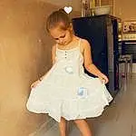 Visage, Yeux, One-piece Garment, Jambe, Dress, Human Body, Flash Photography, Neck, Day Dress, Waist, Happy, Bois, Fashion Design, Baby & Toddler Clothing, Bridal Accessory, Embellishment, Long Hair, Barefoot, Personne