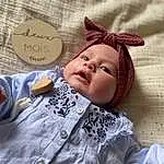 Head, Handwriting, Textile, Sleeve, Doll, Happy, Eyelash, Cap, Baby, Baby & Toddler Clothing, Bambin, Enfant, Jouets, Linens, Pattern, Costume Hat, Baby Products, Poil, Fashion Accessory, Bedding, Personne, Headwear