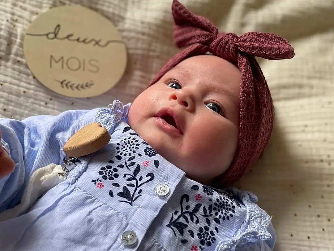 Head, Handwriting, Textile, Sleeve, Doll, Happy, Eyelash, Cap, Baby, Baby & Toddler Clothing, Bambin, Enfant, Jouets, Linens, Pattern, Costume Hat, Baby Products, Poil, Fashion Accessory, Bedding, Personne, Headwear
