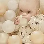 Facial Expression, Blanc, Jouets, Gesture, Balloon, Happy, Event, Party Supply, Enfant, Egg, Drinkware, Bambin, Still Life Photography, Baby Products, Stock Photography, Chest, Baby, Baby Toys, Circle, Personne