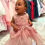 Clothing, Peau, Sourire, Photograph, Facial Expression, Dress, Fashion, Baby & Toddler Clothing, Rose, Happy, Embellishment, Bambin, Headgear, Magenta, Enfant, Fashion Design, Gown, Day Dress, Fun, Beauty, Personne