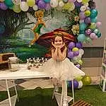 Dress, Plante, Purple, Balloon, Jouets, Decoration, Happy, Rose, Violet, Party Supply, Event, Magenta, Outdoor Furniture, Fun, Robe de Princesse, Outdoor Table, Fashion Design, Herbe, Table, Arch, Personne, Joy