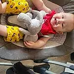 Photograph, Mouth, Blanc, Comfort, Yellow, Baby & Toddler Clothing, Finger, Happy, Baby, Jouets, People, Sourire, Bambin, Thigh, Baby Products, Pattern, Fun, Human Leg, Personne