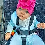 Textile, Baby & Toddler Clothing, Rose, Baby, Cap, Bambin, Headgear, Glove, Enfant, Happy, Fun, Costume Hat, Baby Products, Electric Blue, Fictional Character, Event, Magenta, Fashion Accessory, Pattern, Baby Carriage, Personne, Headwear